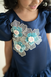 Blue satin a-line dress with 3 flowers